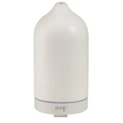 Confezione del kit Purae con un diffusore a ultrasuoni, un adattatore e un misurino.